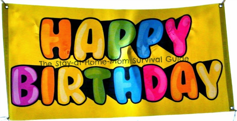 Basic Happy Birthday Banner from BuildASign.com as a reusable kids birthday decoration reviewed at The Stay-at-Home-Mom Survival Guide