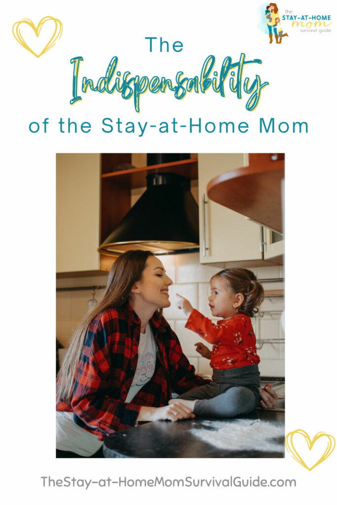 Mother smiling at toddler daughter in their kitchen. Text reads the indispensability of the stay-at-home mom.