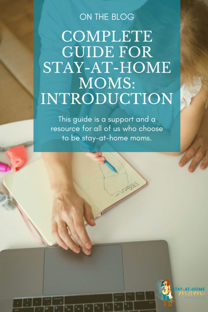 Mom using a laptop to read the complete guide for stay-at-home moms with a toddler in her lap coloring.