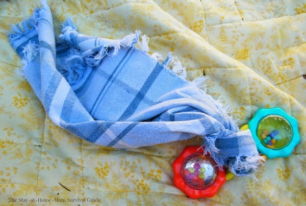 Auditory and visual sensory stimulation sensory bin for infants. Great activity for babies to enhance and extend tummy time.
