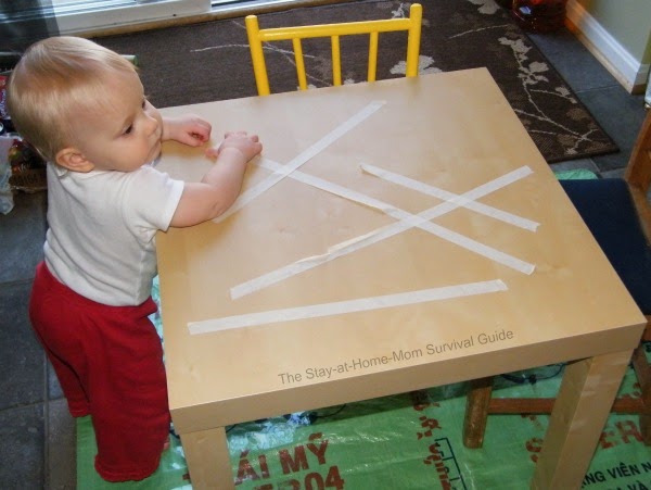Toddler tape removal activity only requires one supply and works in fine motor skills.