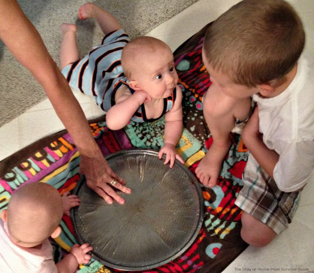 Tips for infant water play indoors. Great sensory activity that can be done without too much mess indoors.