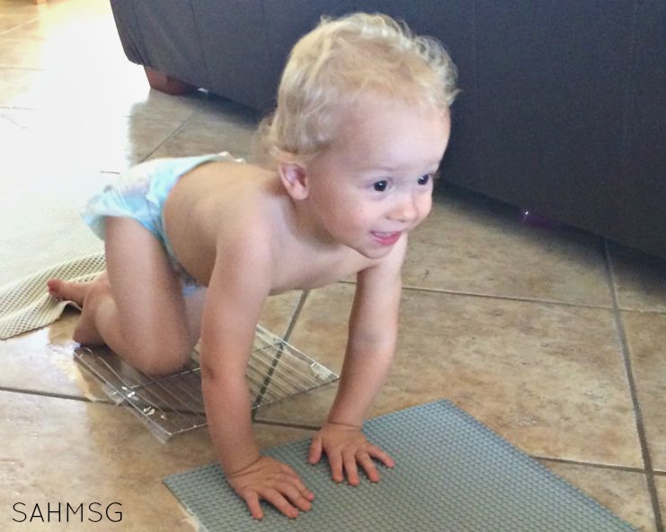 Easy to set-up sensory crawl activity for infants and toddlers gets crawlers and walkers moving and exploring indoors.