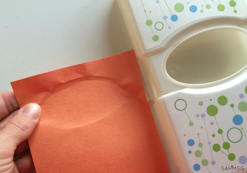 Peek-a-boo box for infants using a travel wipes container. Teaches name, and object permanence.