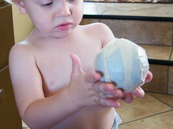 Create this activity for babies in 5 minutes with 2 supplies! Sticky Ball Fine Motor Activity for Infants encourages fine motor skills, brain development and play.