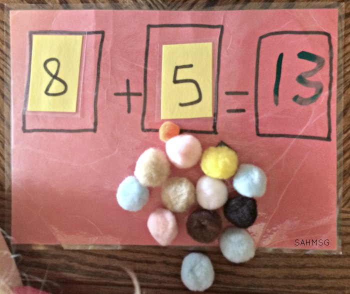 Explore addition with a hands-on addition busy bag for practicing addition concepts, counting and number identification for children in kindergarten or as young as preschool. Adaptations included for younger children.