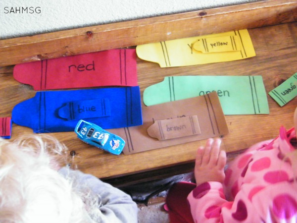 Crayon color sorting activity for toddlers at home.