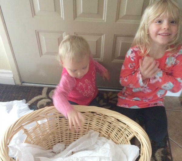 Too cold to play in the snow outside or don't have any snow where you live? Bring the snowball toss indoors for some gross motor fun for babies, toddlers, preschoolers and school age kids. This is so easy to set up with only two supplies. Great for indoor winter fun!