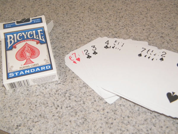 Learning greater than less than with playing cards builds number sense and math skills with a hands-on activity for kindergarten and early elementary age kids.