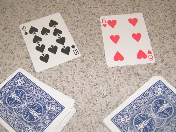 Learning greater than less than with playing cards builds number sense and math skills with a hands-on activity for kindergarten and early elementary age kids.