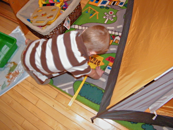 At home word find with DIY dollar store flyswatter as a wand. Great reading activity for preschoolers.