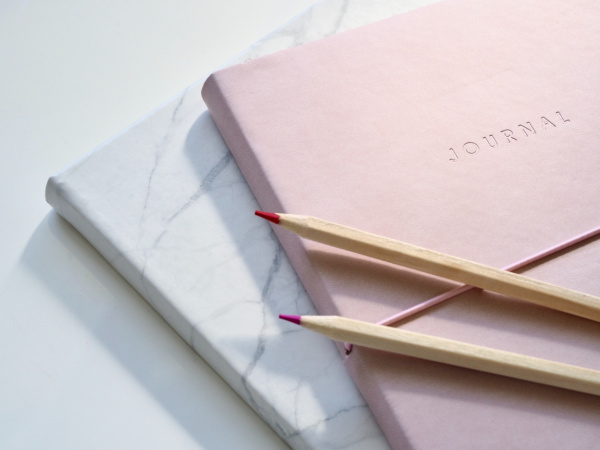 Journaling is a helpful action for maintaining a state of gratitude in motherhood.