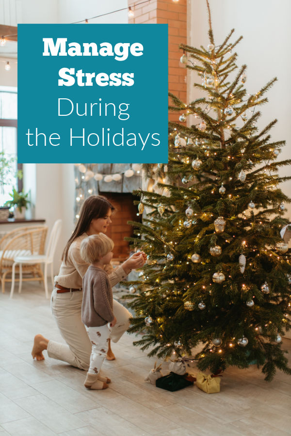 Mom and child decorating the tree.