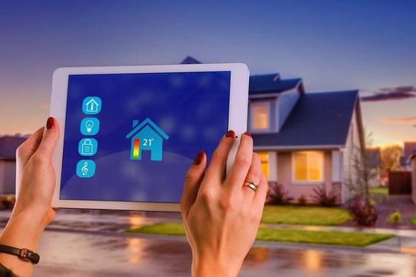 Smart-home tablet adjusting thermostat. Title reads protecting your smart-home from hackers.