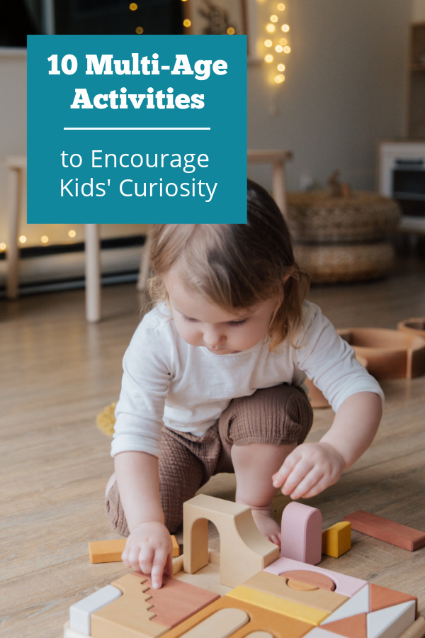 Child playing with a puzzle on the floor. Text reads 10 multi-age activities to encourage your kids' curiosity.