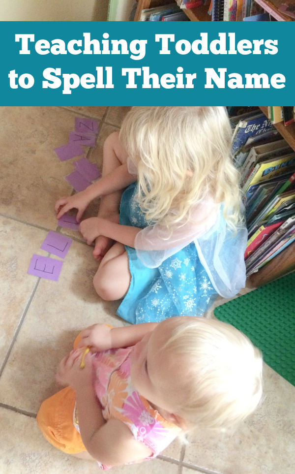 Kids sitting on the floor spelling out their names with the name game cards.