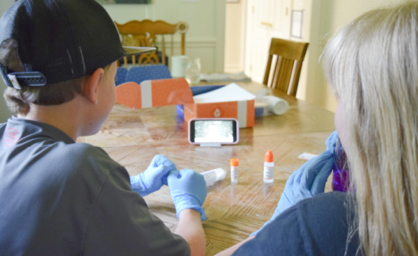 Children of a variety of ages can work together on the science kit experiments for kids.