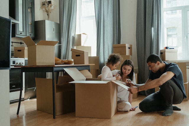 A family packing their belongings for a relocation.