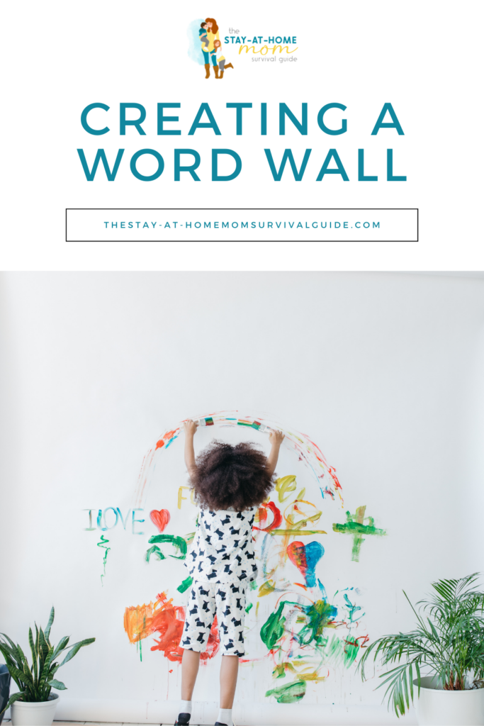 Child reaching up and painting on the wall. Text reads creating a word wall at home. Preschool learning activities at home.