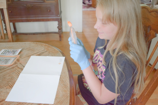 Child watching video instructions to complete the DIY hot and cold packs experiment.