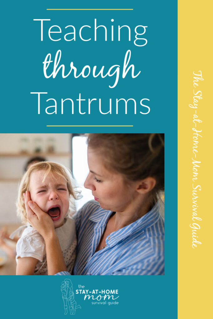 Mom holding a toddler who is visibly upset. Text reads teaching through tantrums.