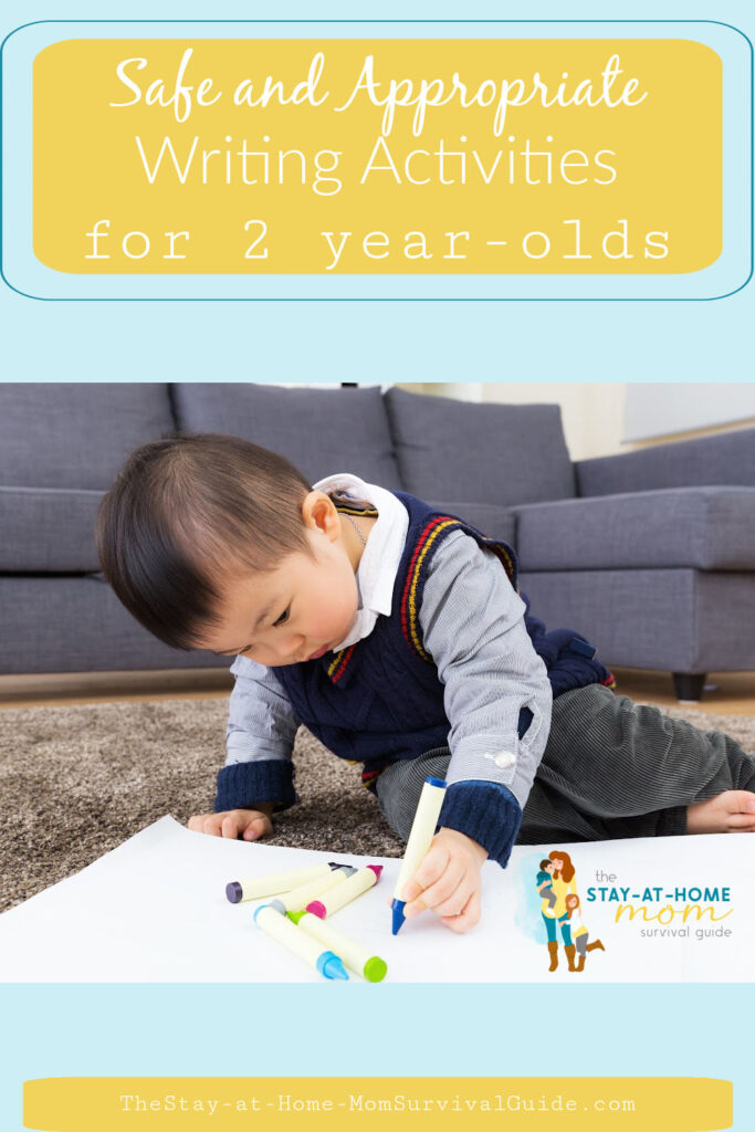 Toddler boy sitting on the floor drawing with crayons on a piece of large white paper. Text reads safe and appropriate writing activities for 2 year olds.