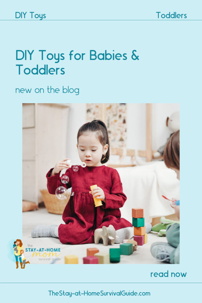 Toddler girl playing with toys on the floor. Text reads DIY toys for babies and toddlers new on the blog.