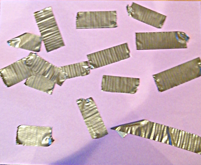 Duct tape pieces on purple construction paper.