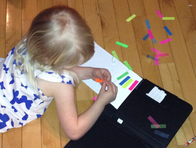 toddler fine motor work with sticky tabs
