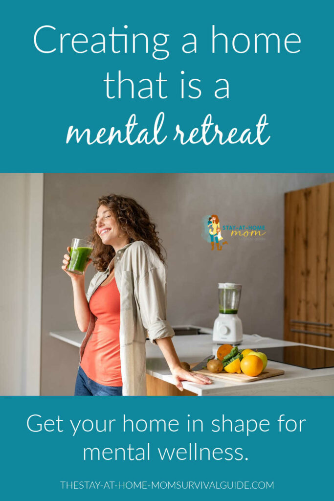 Woman leaning against her kitchen counter with fruit and a blender next to her sipping a green smoothie. Text reads how to create a home that is a mental wellness retreat.