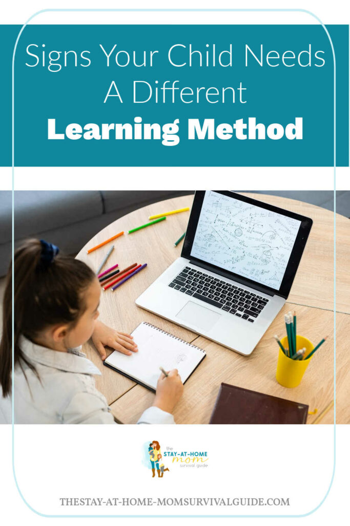 Girl seated at a table looking at laptop screen while writing in a notebook. Text reads signs your child need a different learning method.
