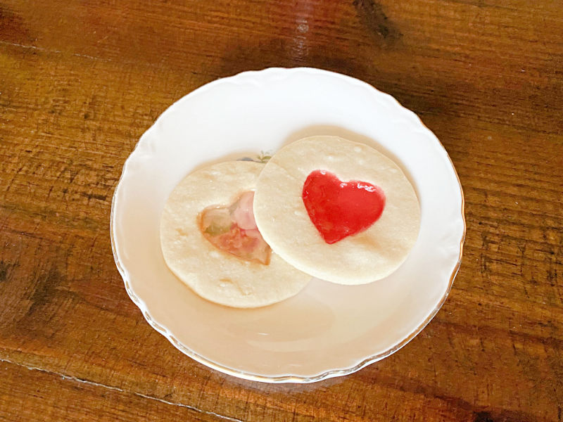 Two cookies on a plate.