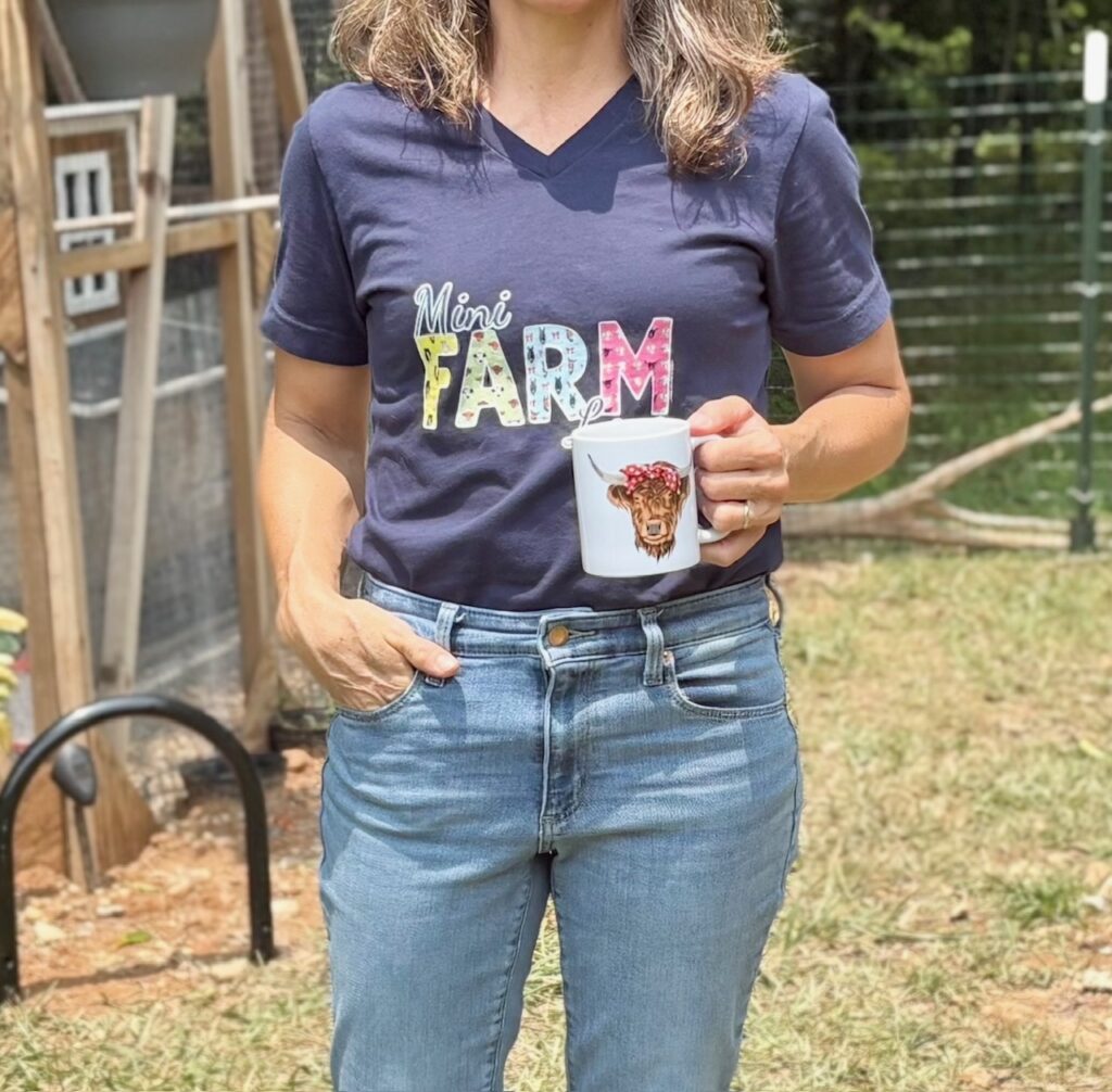 Close up of Mini Farm love T-shirt and Petunia coffee mug from Katie Can Slyke's shop.