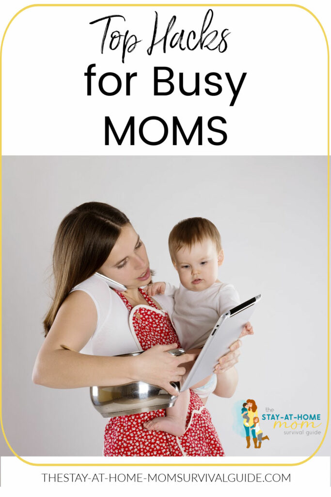 Mom holding a baby and an ipad looking overwhelmed. Text reads top hacks for busy moms.